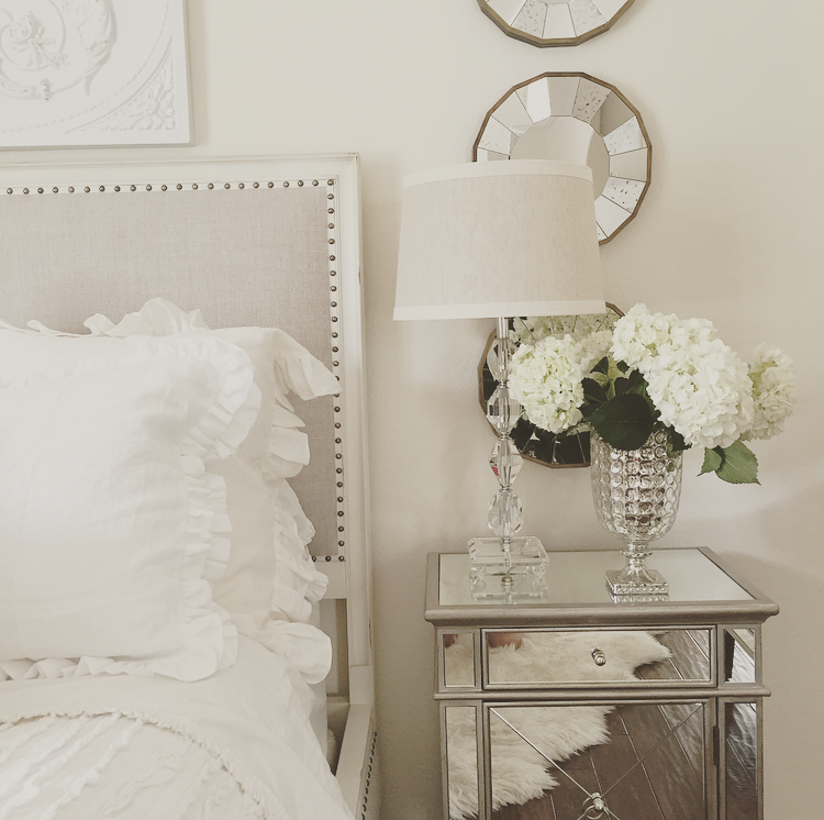 easy bedroom make over mirrored nightstand, white roses, white bedding, mercury glass