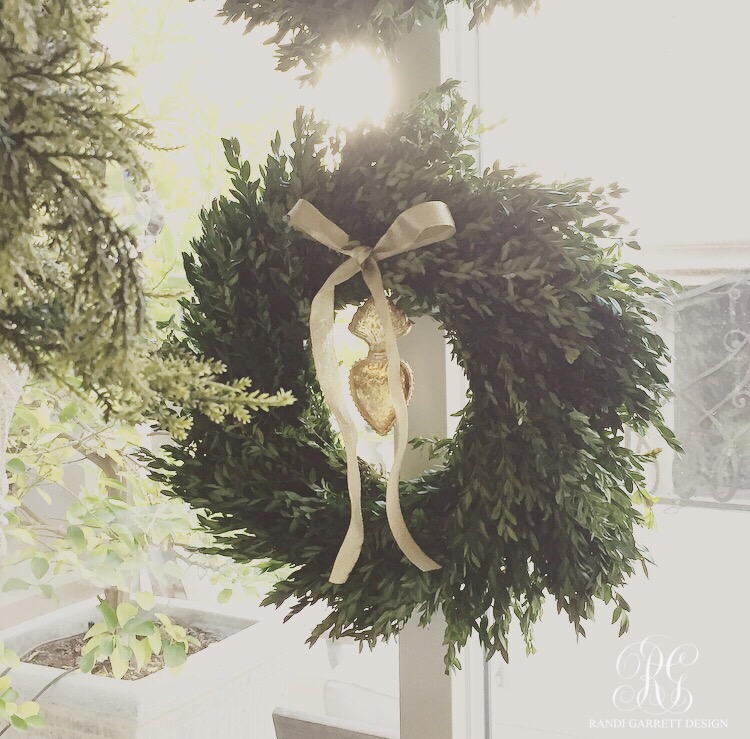 Fresh boxwood wreaths with sacred heart Christmas ornament