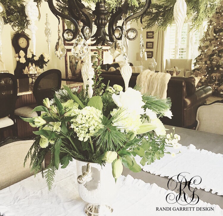 Christmas floral arrangement centerpiece with white hydrangea , roses and lilies