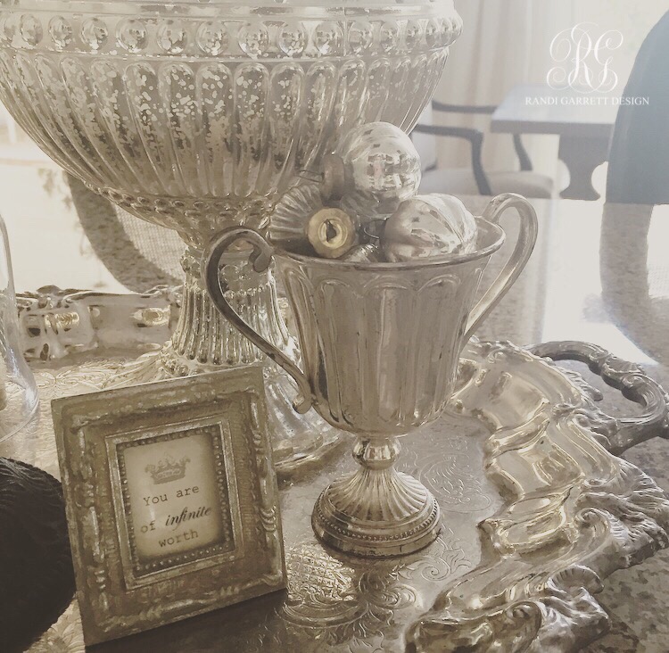 Mercury glass ornament in a vintage trophy cup