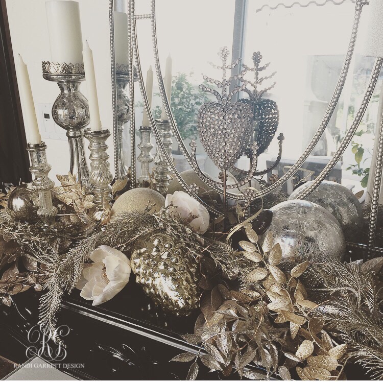 Silver and gold Christmas tablescape with mercury glass candle sticks and onraments