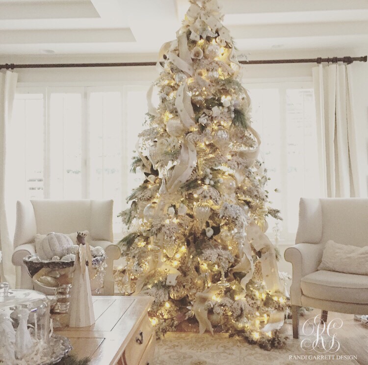 White flocked Christmas tree with mercury glass ornaments and ribbon