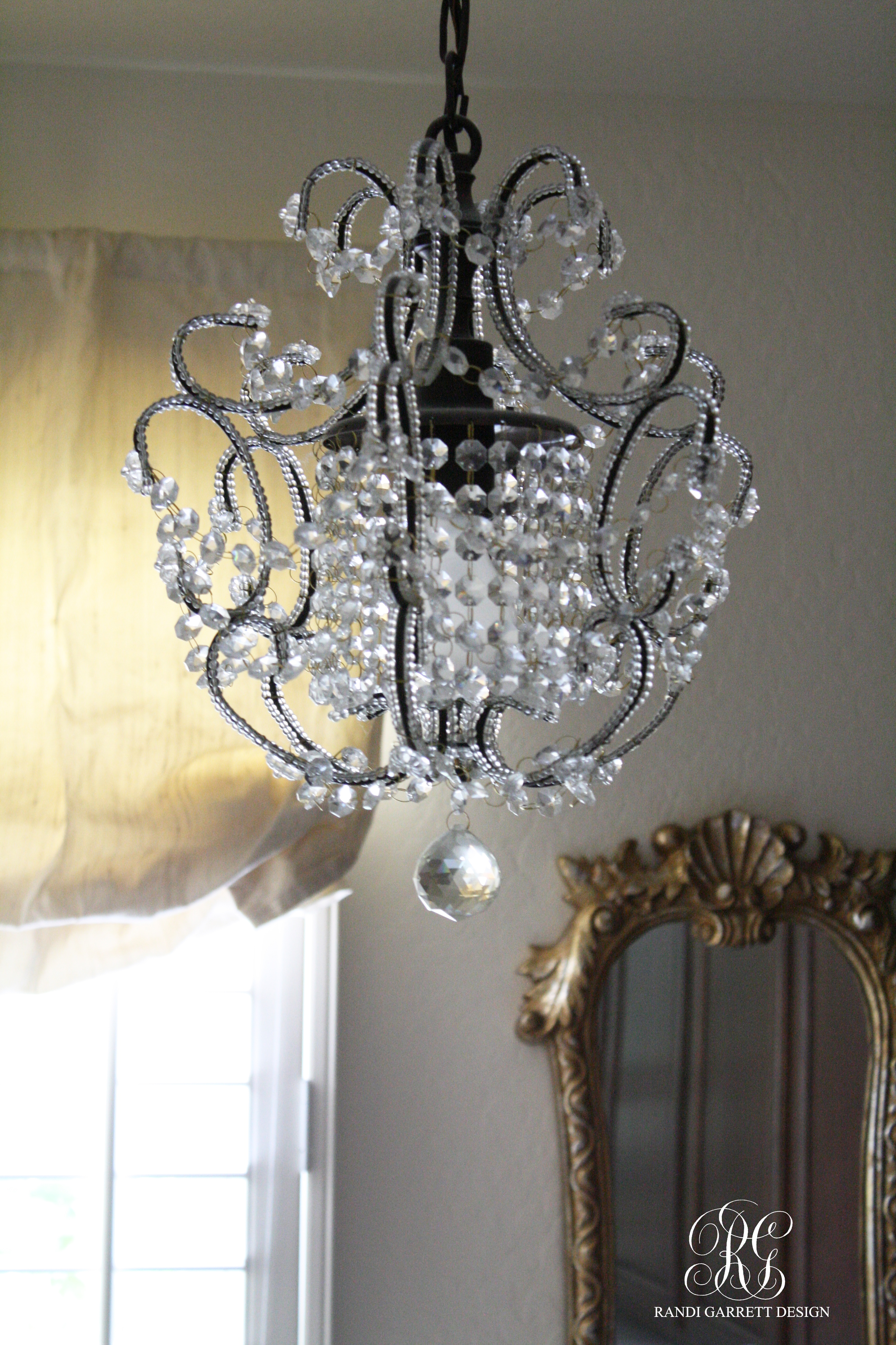 Randi Garrett Design Laundry Room with mini chandelier
