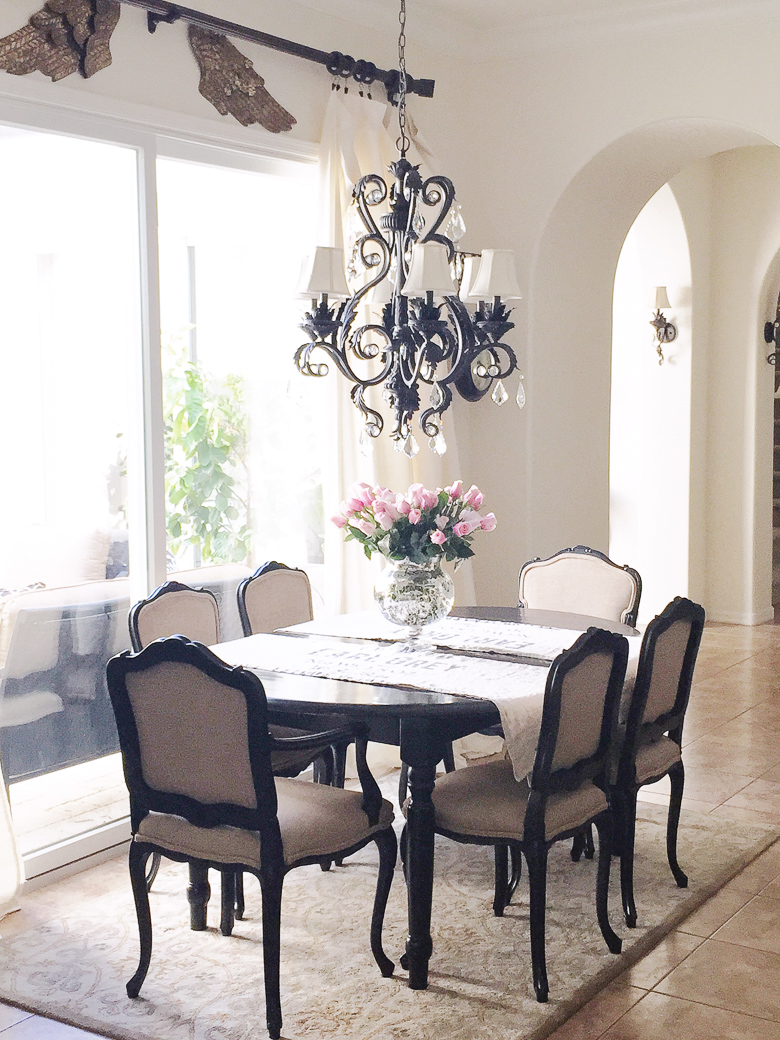 Kitchen table with black French style chairs by Randi Garrett Design