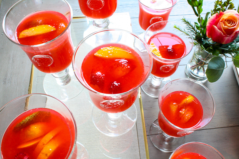 Skyros Designs Eternity Glass Goblets with peach raspberry lemonade 