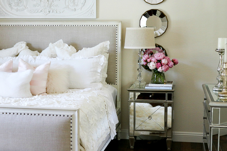 White glam master bedroom with pops of pink