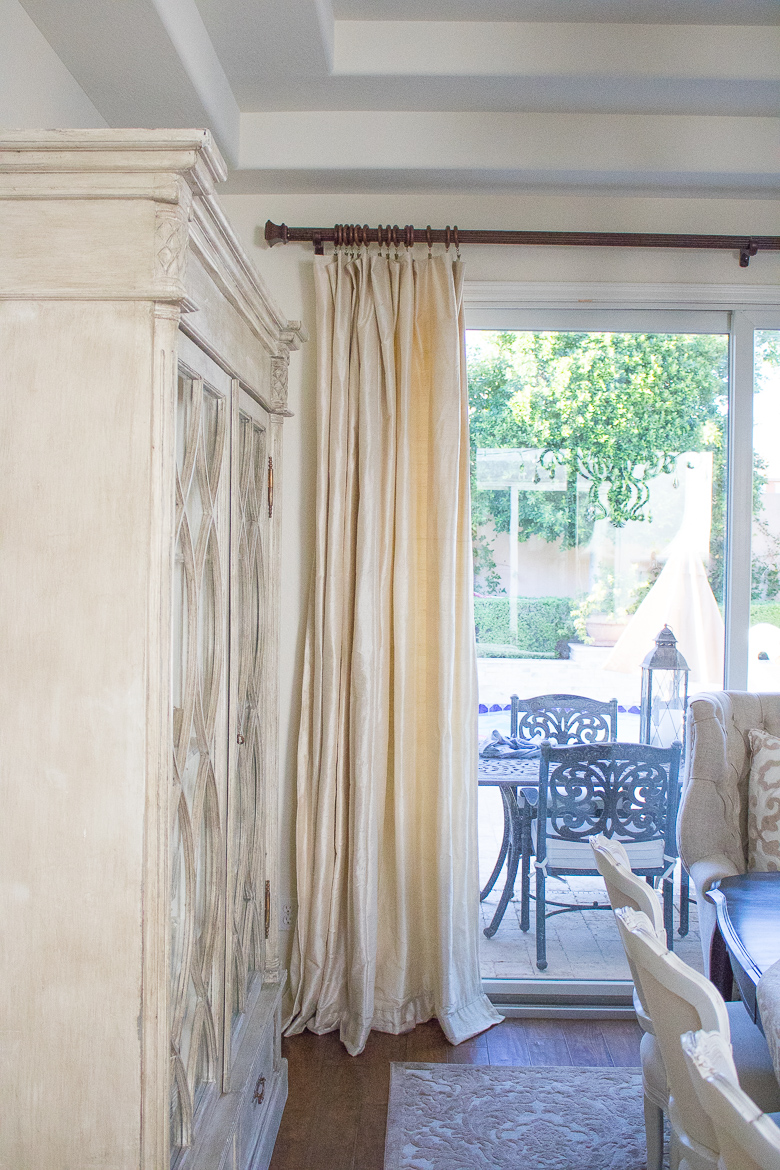 Cream silk drapes in elegant dining room