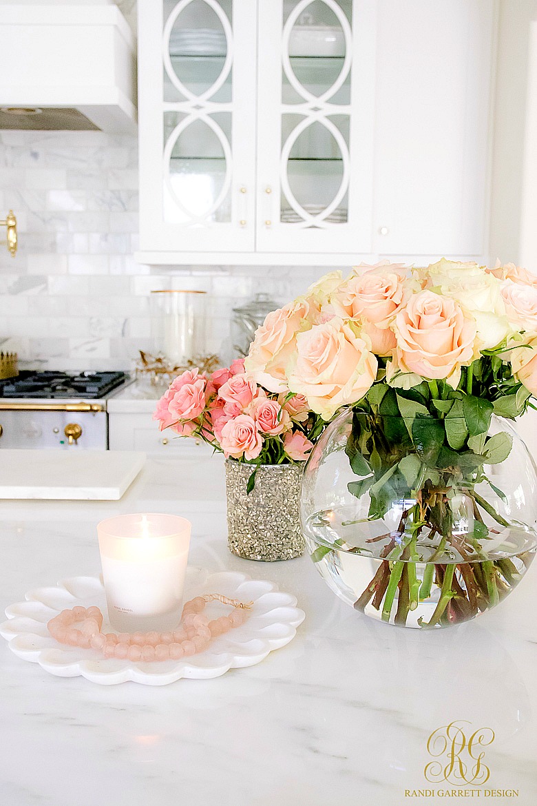 Candle styling tips - gorgeous pink roses in white kitchen 
