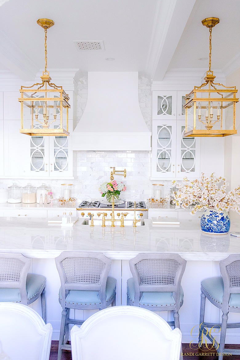 white kitchen with marble countertops