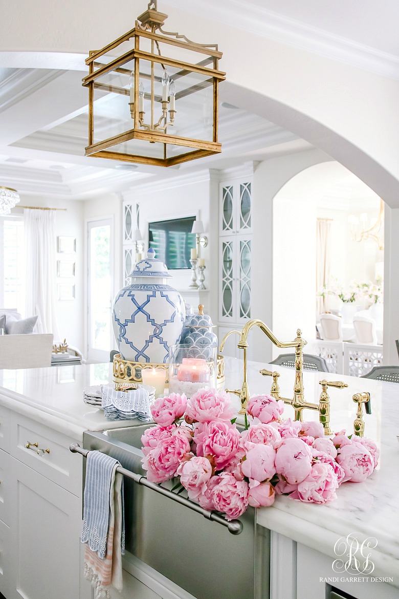 white kitchen sink of pink peonies - styling tips for summer