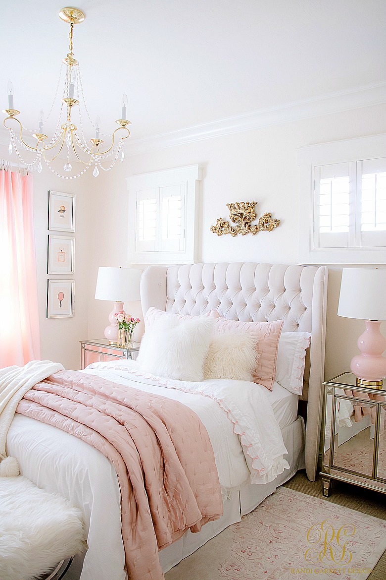 pink and white tween bedroom - brass crystal chandelier -tufted wing back bed
