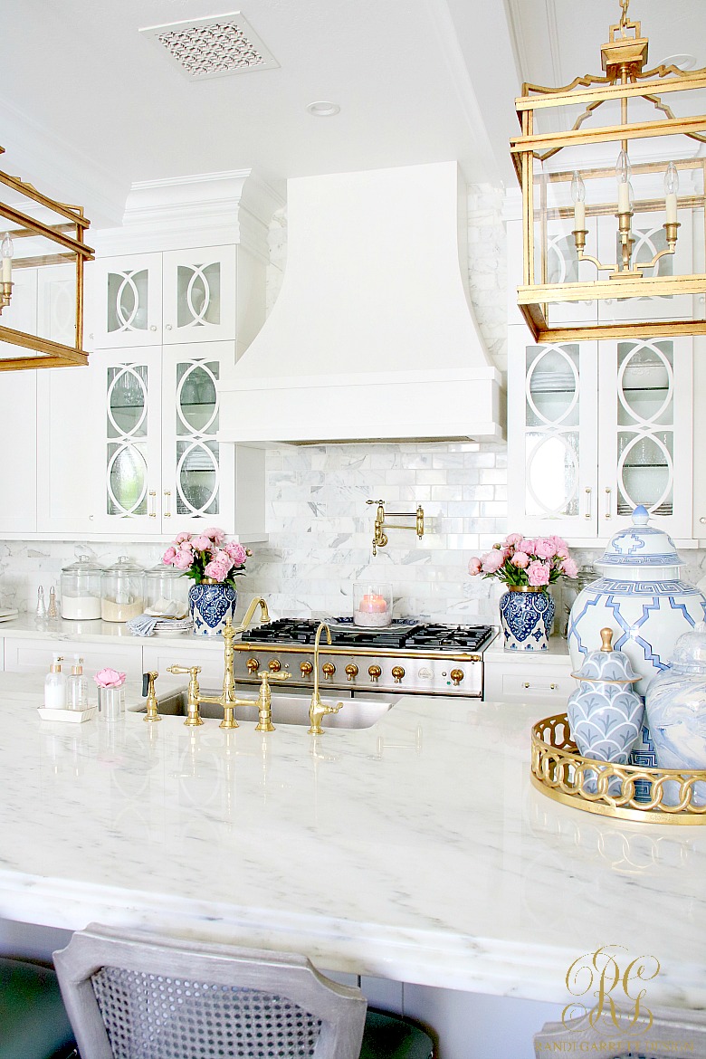 gorgeous white kitchen- marble countertops - marble backsplash - candle styling tips