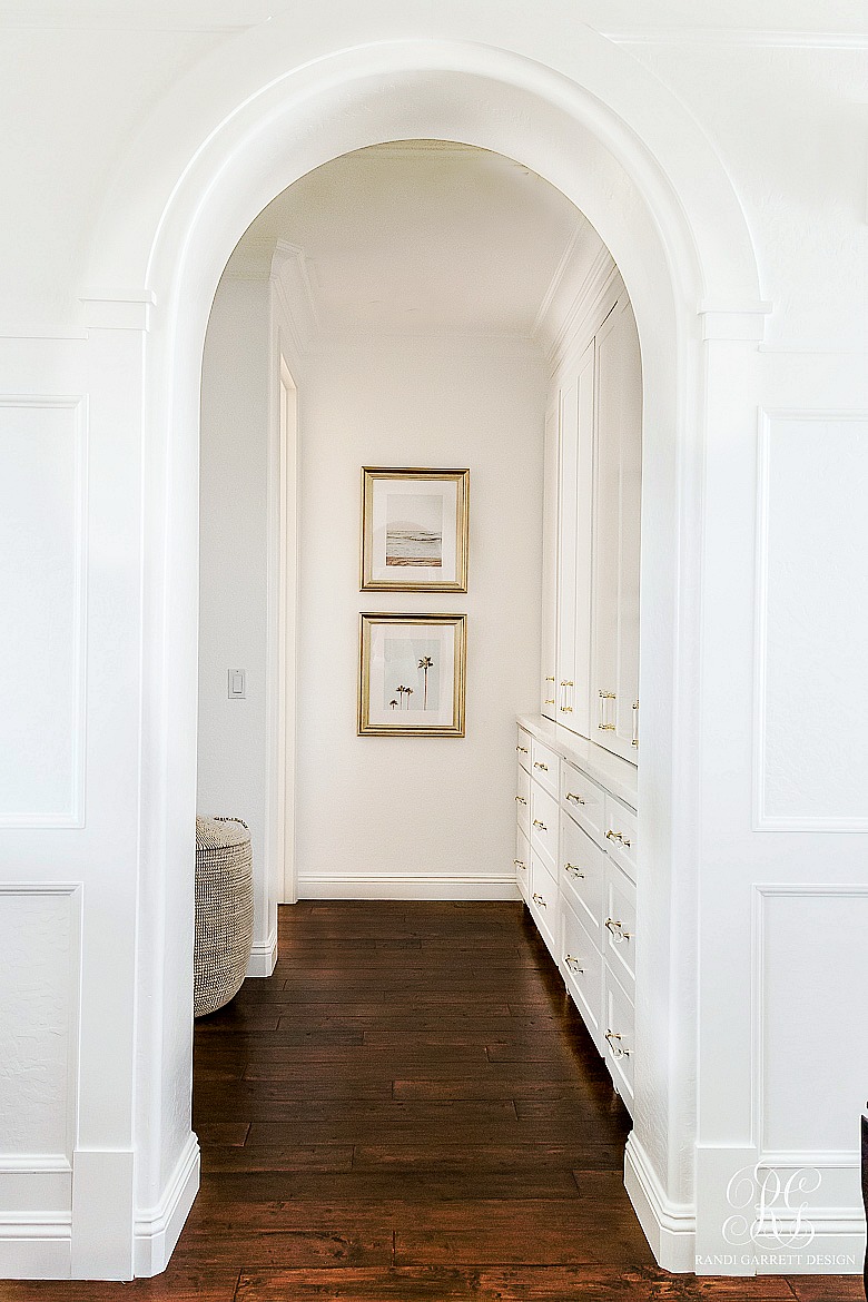 white trimmed walls - trimmed archway - transitional family room 