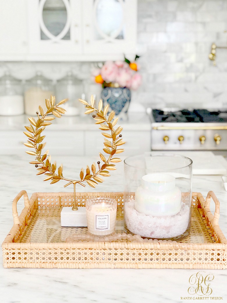 wicker tray with laurel wreath and candle vignette