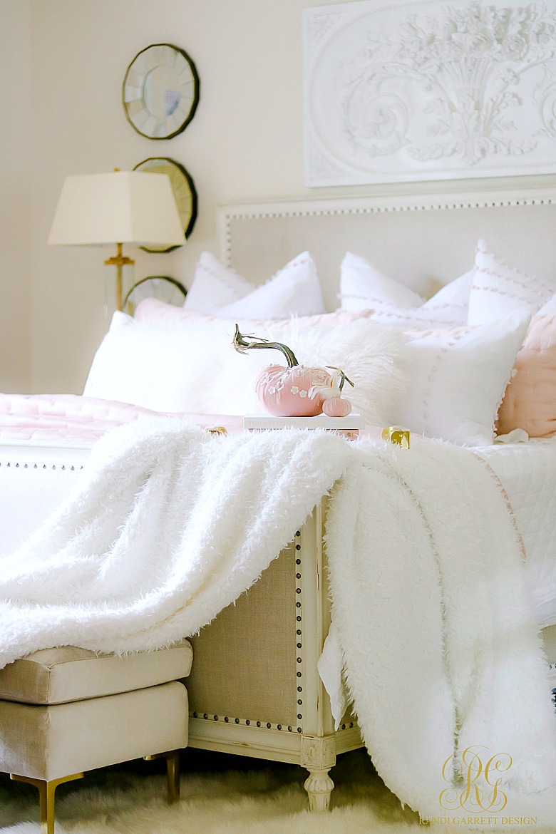 beautiful pink glam bedroom styled for fall - blush velvet pumpkins