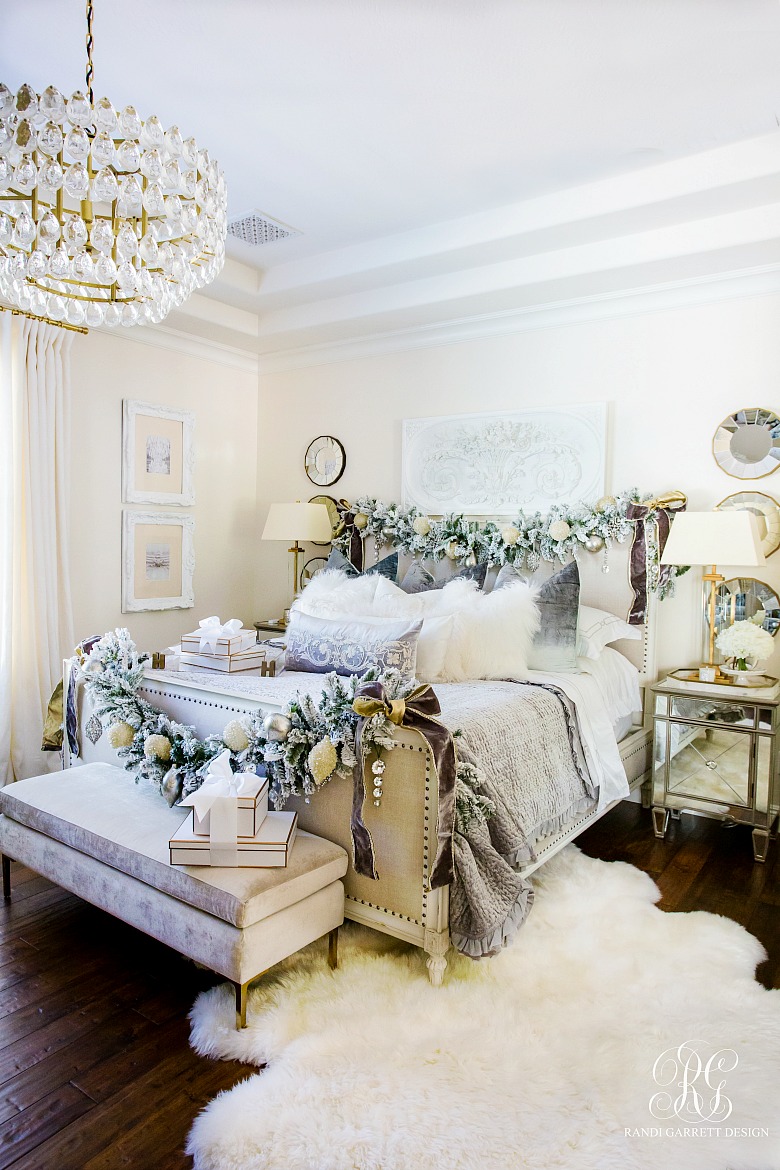 bed styled for christmas with garlands