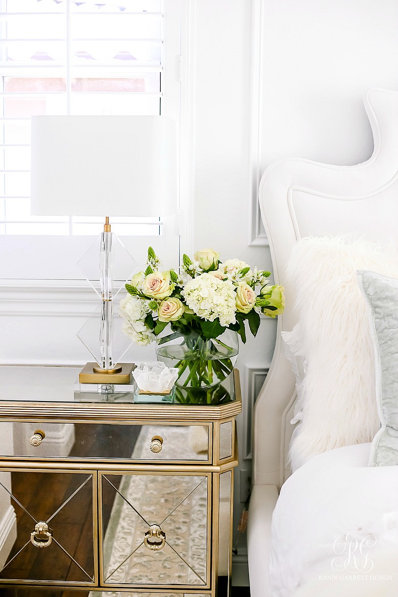 mirrored nightstands with rose and hydrangea arrangement 