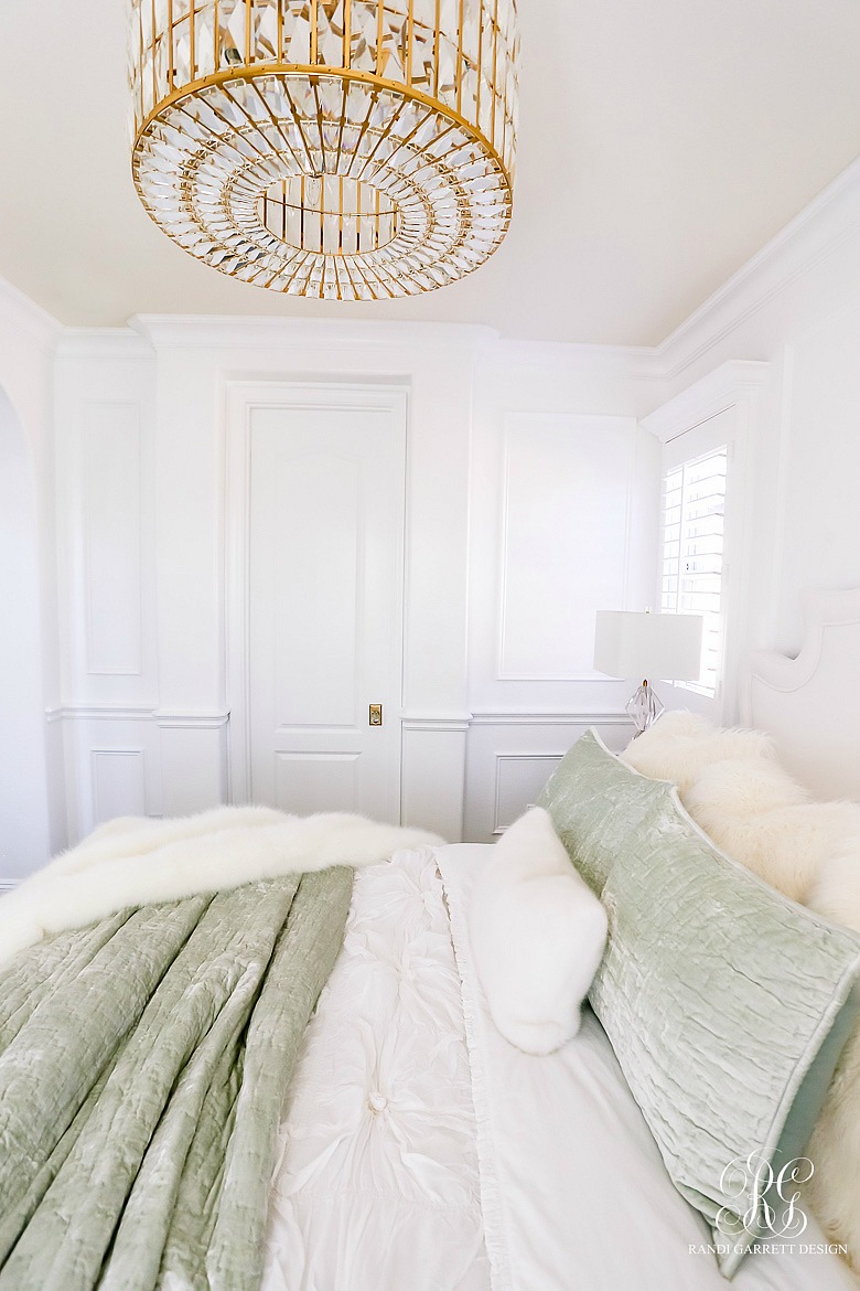 white wainscoting - glam bedroom - velvet fur bedding