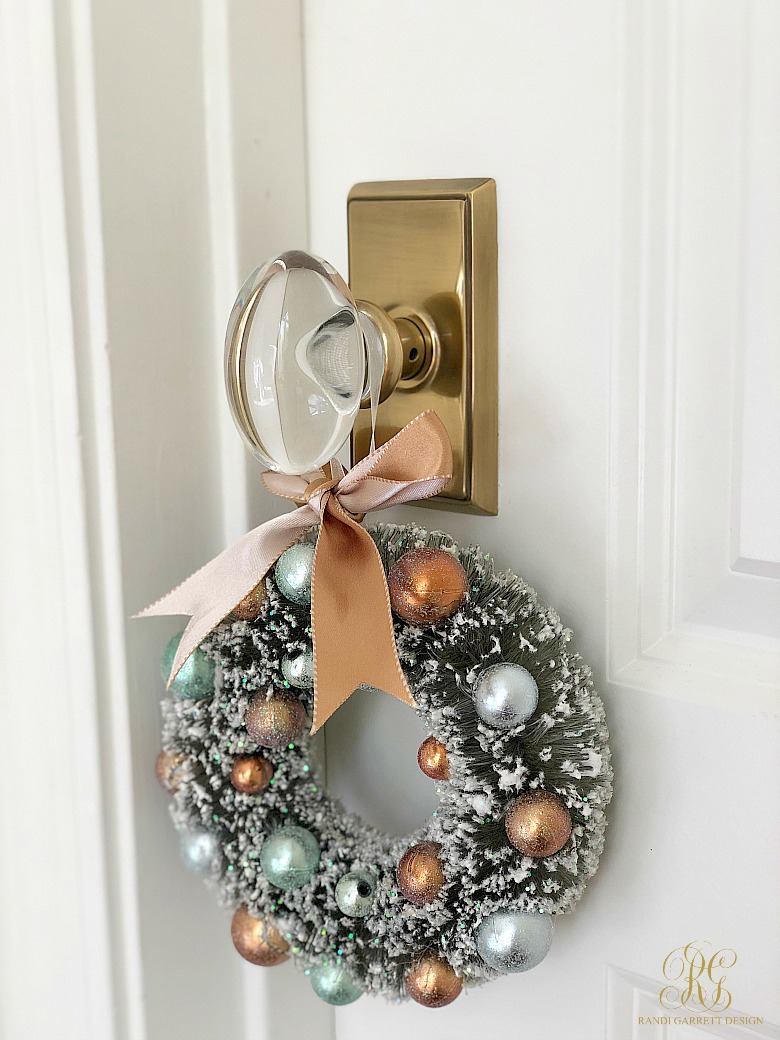 crystal and brass doorknob with mini christmas wreath