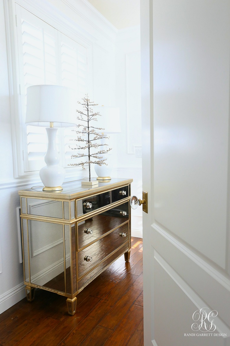 mirrored chest with mini christmas tree