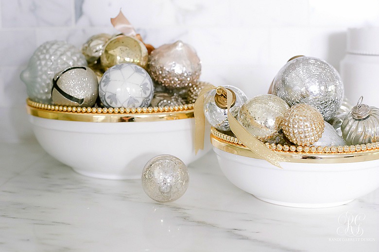 Christmas ornaments in white and gold bowls