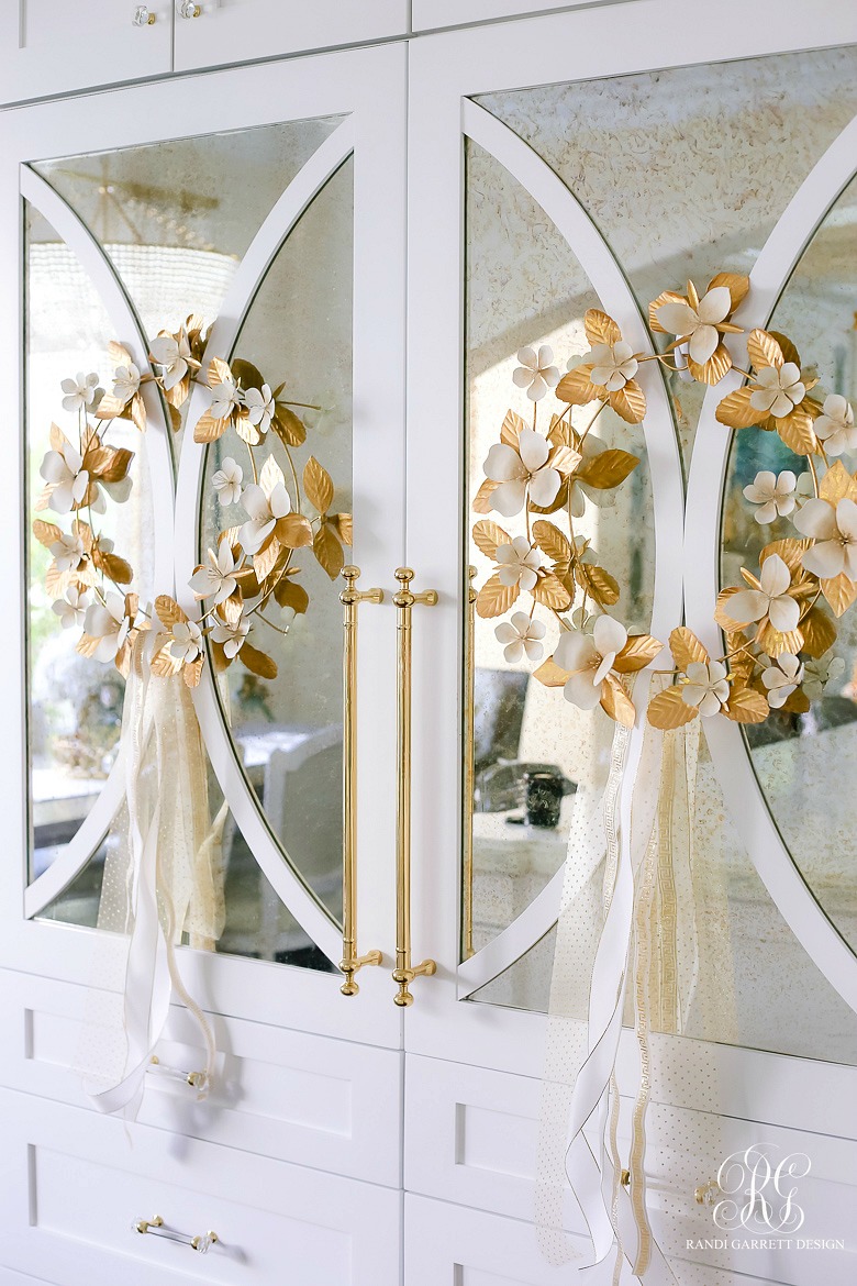 gold and white christmas wreaths on fridge