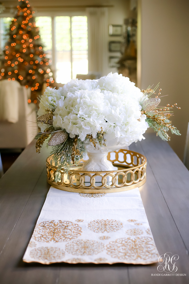 beautiful Christmas centerpiece on gold tray and beaded runner