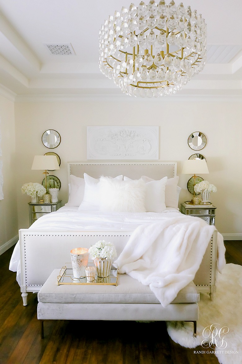 Glamorous White master bedroom - transitional chandelier - white fur bedding