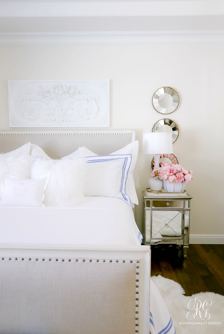 white bedroom with pink peonies -white bedding