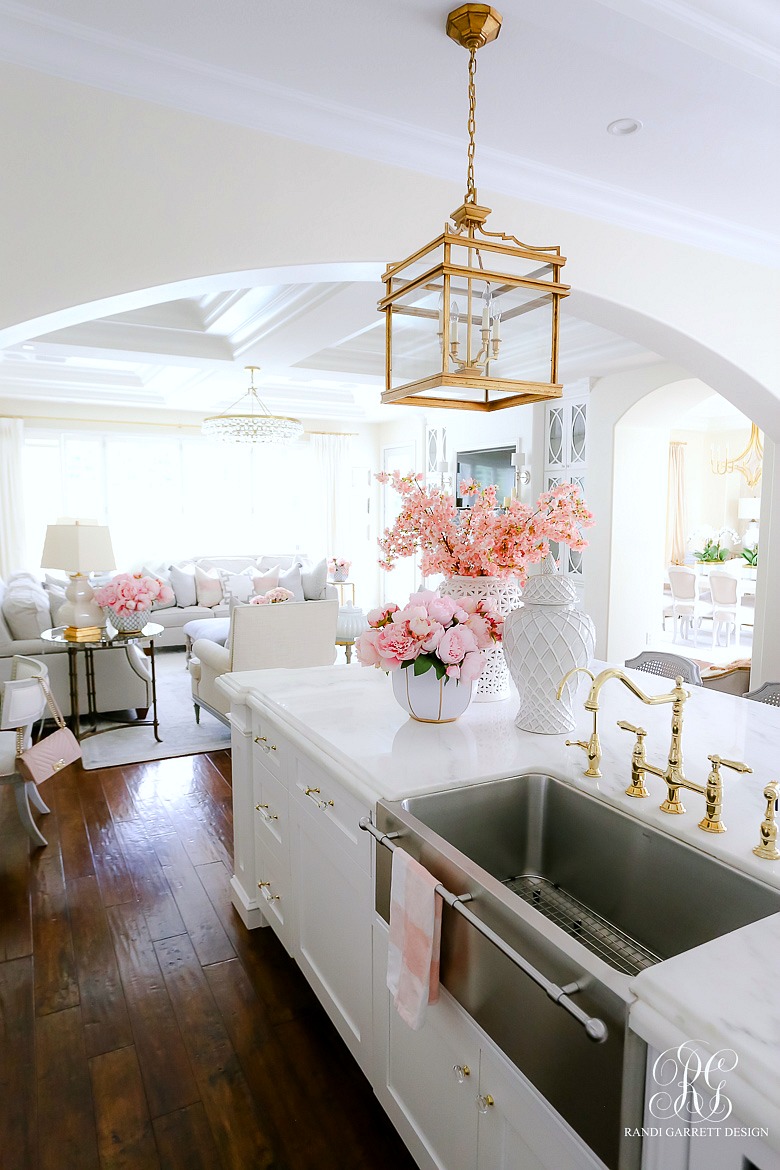 white glam kitchen - gold lanterns - pink flowers