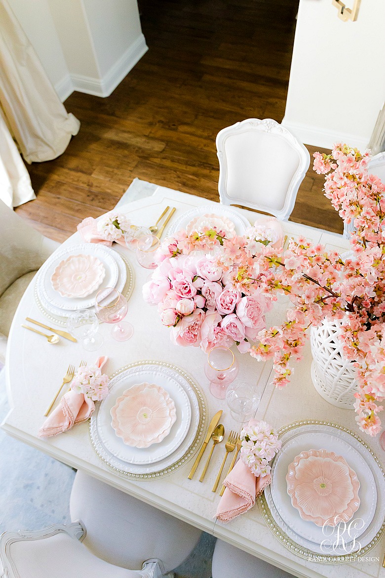 beautiful spring table with pink peonies cherry blossoms