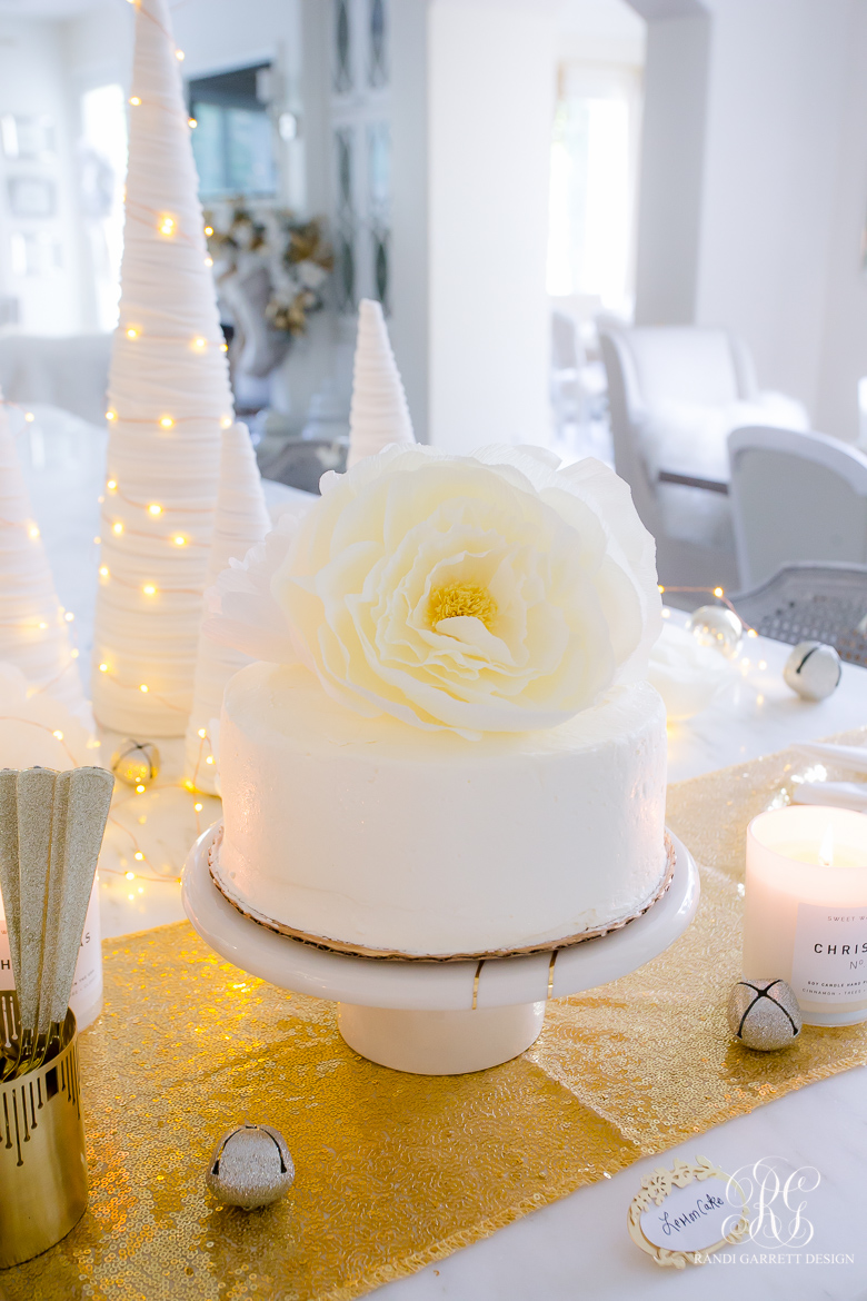 white cake crepe paper flower topper