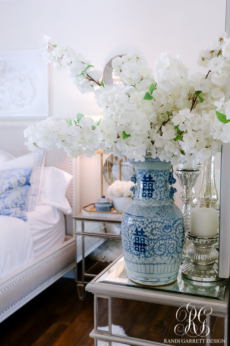 white cherry blossoms blue and white vase