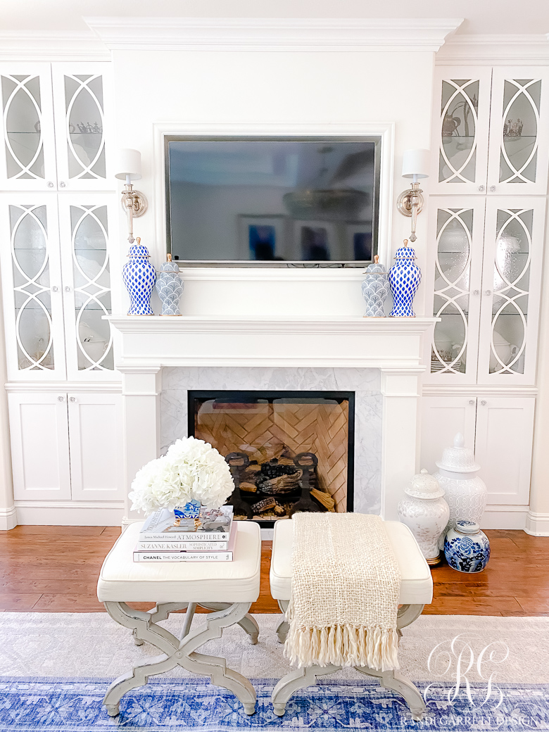 white fireplace white custom cabinets