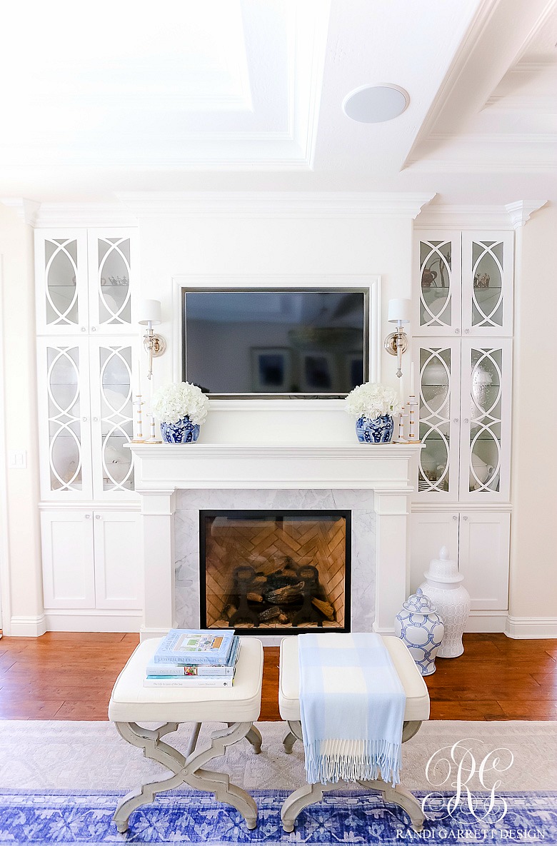 white fireplace builtin bookcases mullion doors