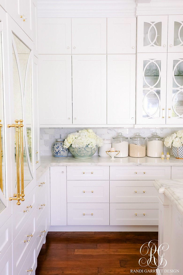 white kitchen cabinets gold accents