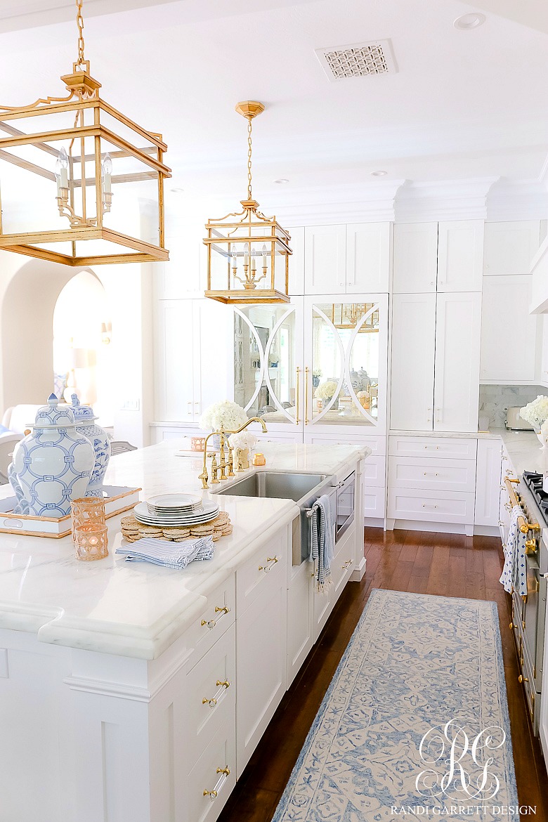 white kitchen blue gold accents