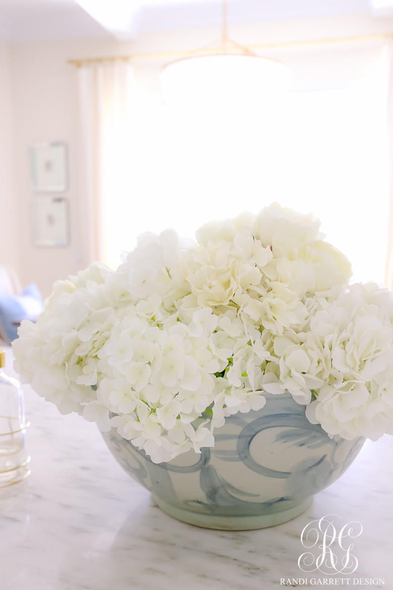 white hydrangea arrangement blue white bowl