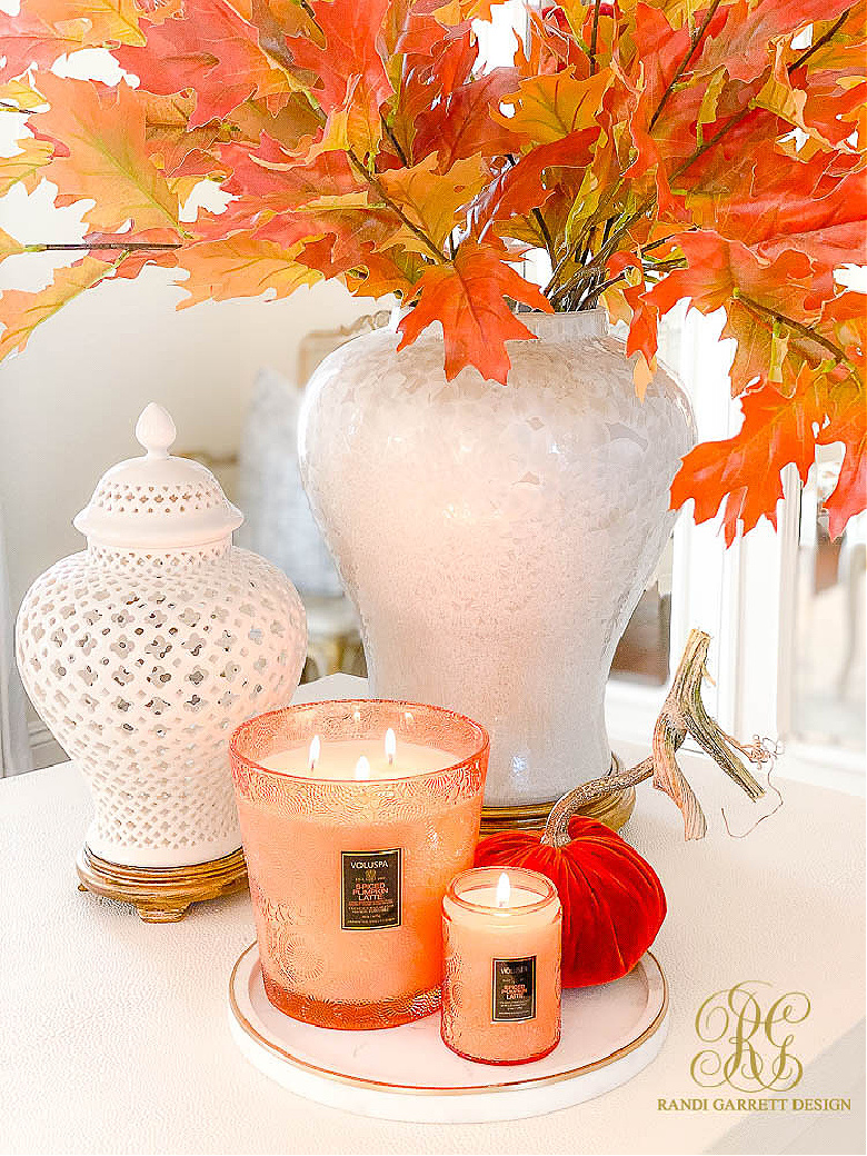 white ginger jars fall leaves fall candle 