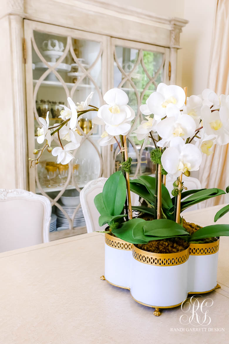 faux orchid in cache pot