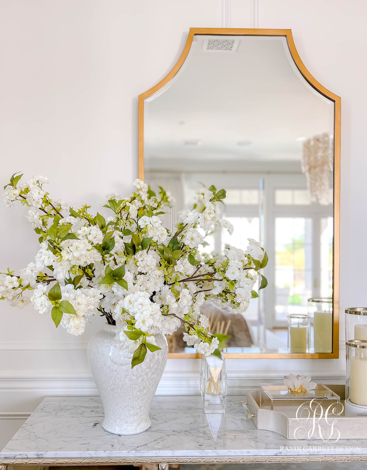 white cherry blossoms white ginger jar gold mirror