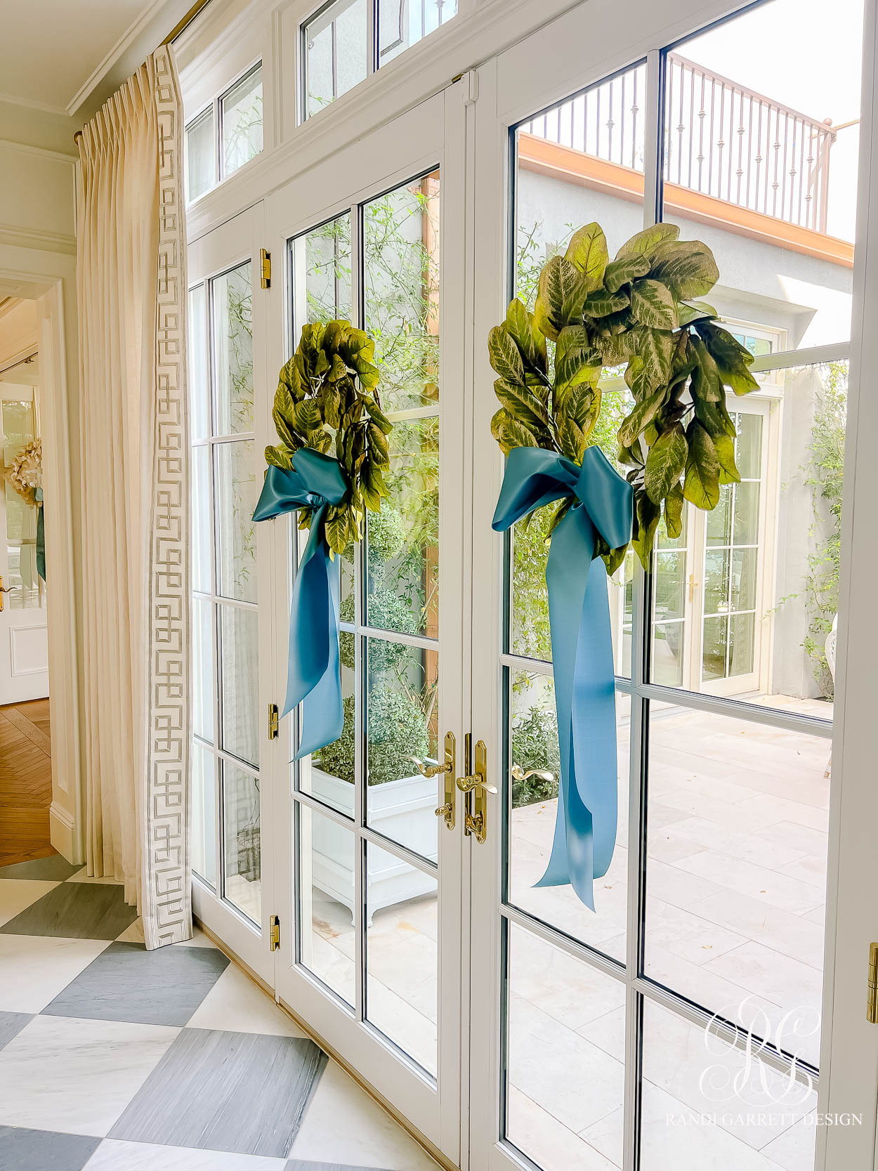 Windows Dressed for the Season: Magnolia Wreaths & Blue Ribbon